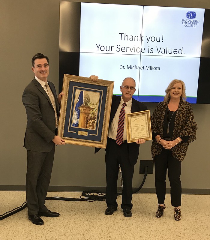 SCC President Michael Mikota (right) announces the Mandy Painter (right) as the next executive director following Daryl Smith's retirement (middle). (Photo/Provided)