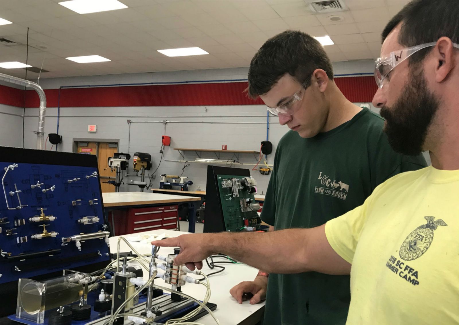 Hunter Richey, a junior at Belton-Honea Path High School, works with a hydraulic trainer under the instruction of his teacher Ben Woody. (Photo/Teresa Cutlip)
