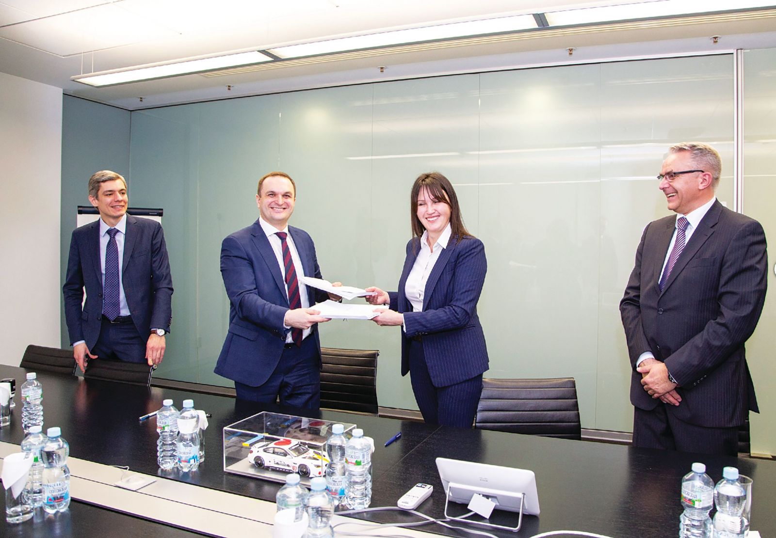 BMW Russia CEO Irina Shramko meets with AVTOTOR officials to finalize a $305 million investment in a production line for the country's most popular models. (Photo/Provided)