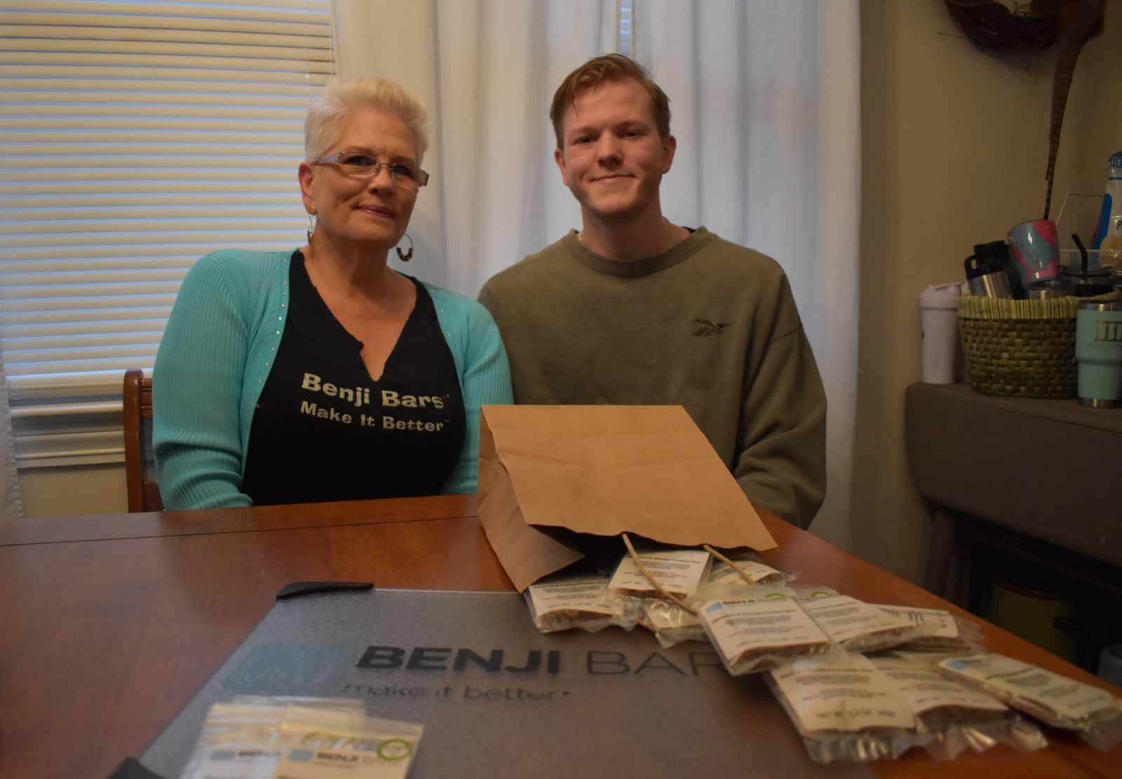 Julie and Benji Maddox pose with a few of her bars, which she took off her website marketplace and out retail stores in the period of trademark uncertainty following her realization that she had sent her renewal payments to a fraudster instead of the U.S. Patent and Trademark Office. (Photo/Molly Hulsey)