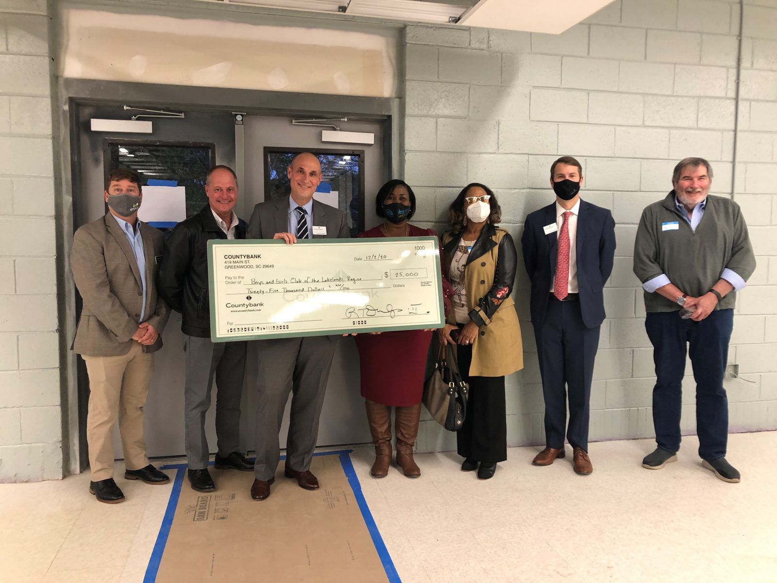 Countybank and Greenwood Capital present a $25,000 check to the Boys and Girls Clubs of the Lakelands Regions. (Photo/Provided)