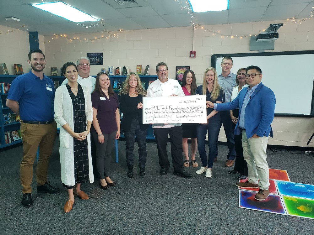Members of the Leadership Greenville Class 47 present representatives from Greenville Technical College, the Greenville Tech Foundation ,and West Greenville School with a check for $9,236.76. (Photo/Provided)
