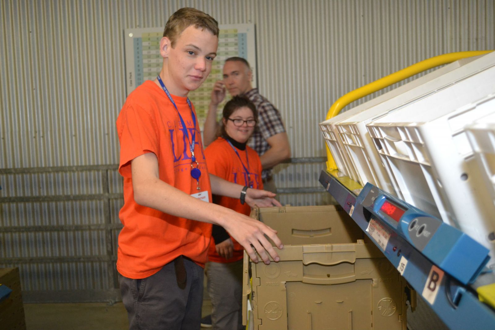 Sam Mungo and Emma Adams, ClemsonLIFE students, train for work at the Walgreens Distribution Center, which resupplies retail items at Walgreens stores from Washington, D.C., to Florida. (Photo/Ross Norton)
