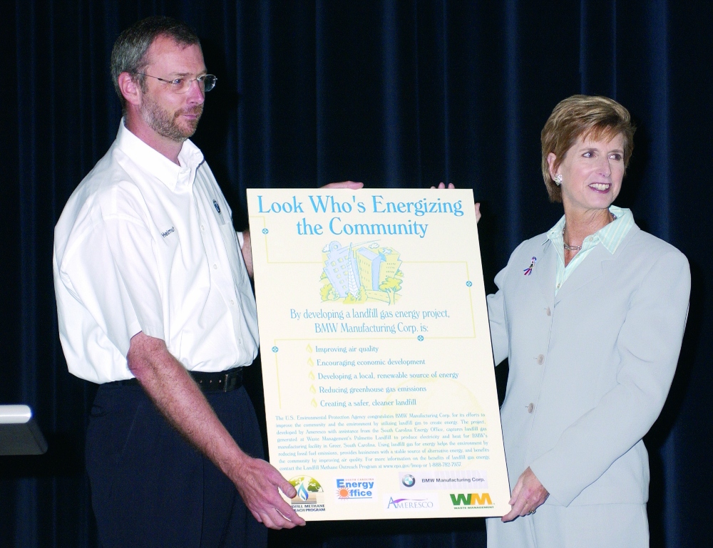 Helmut Leube, president of BMW Manufacturing from 2000-2004, stands with EPA Administrator Christine Todd Whitman at BMW's landfill gas announcement in 2003. (Photo/BMW Archive)