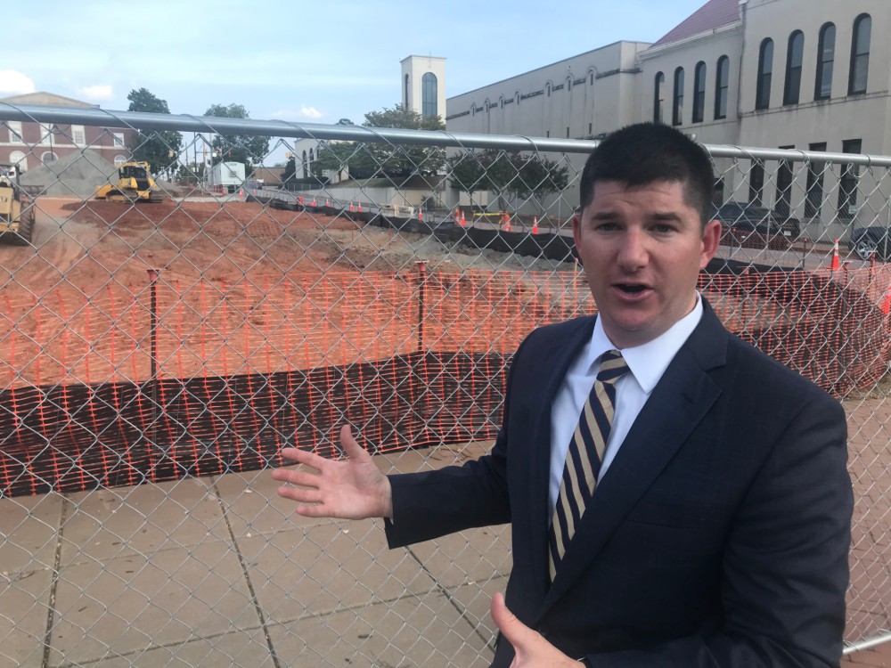 David McCuen, Anderson city manager, talks about downtown development in front of the construction site for the Home2 Suites by Hilton. (Photo/Teresa Cutlip)