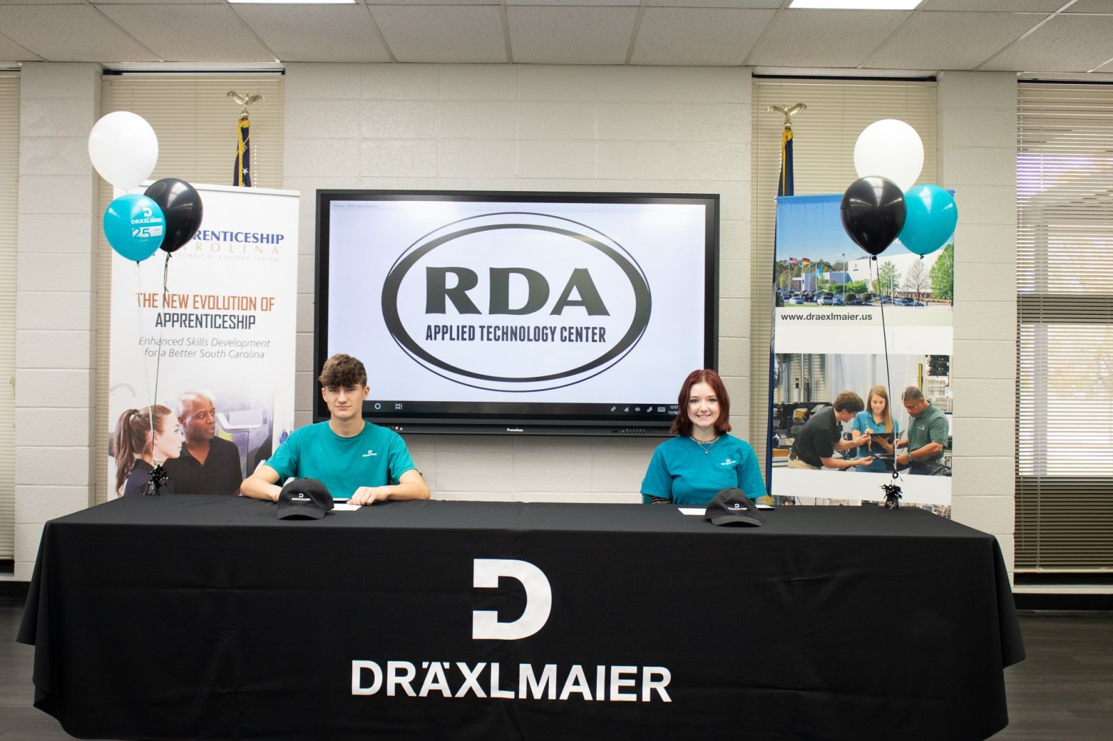 Machine tool apprentice Ivan Kurpis and mechatronics apprentice Evelyn Atkins signed on to a three-year commitment at the company's Duncan plant last week. (Photo/Provided)