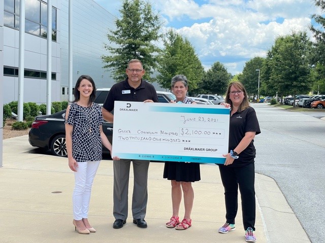 Duncan Draxlmaier employees Sandra Ganghofer (far left) and Lisa Champion (far right) present the $2,100 donation to Donny Kauffman and Krista Gibson of Greer Community Ministries. (Photo/Provided) 