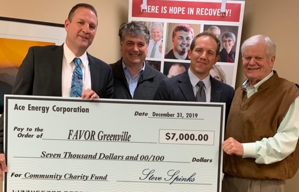 Richard L. â€œRichâ€_x009d_ Jones, CEO of Favor Greenville, accepts a check from Steve Spinks, president of The Spinx Co. Inc.; Jacob Hubbard, territory manager, Motiva Enterprise LLC; and Stewart Spinks, chairman, The Spinx Co. Inc. (Photo/Provided)