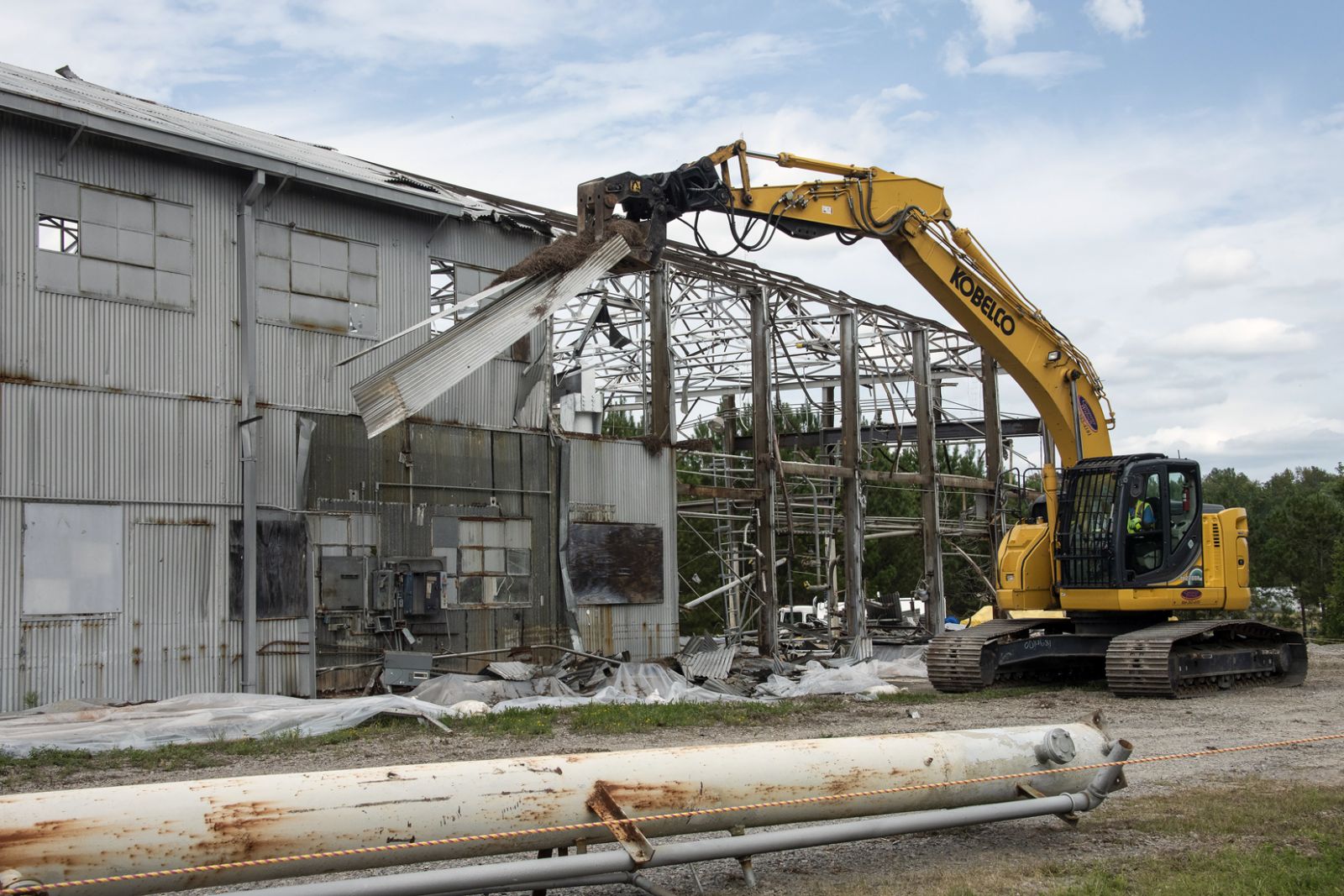 At the height of the Cold War, the Ford Building was used to test components used in five nuclear reactors at the Savannah River Site. An excavator is shown here removing a section of the facility's metal roof. (Photo/Provided)