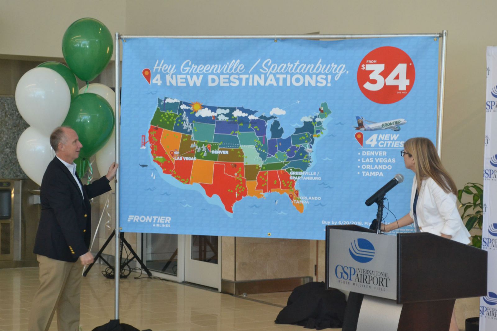 Dave Edwards, president and CEO of GSP, and Tyri Squyres, vice president of marketing for Frontier, announce the new nonstop flights Frontier will offer. (Photo/Ross Norton)