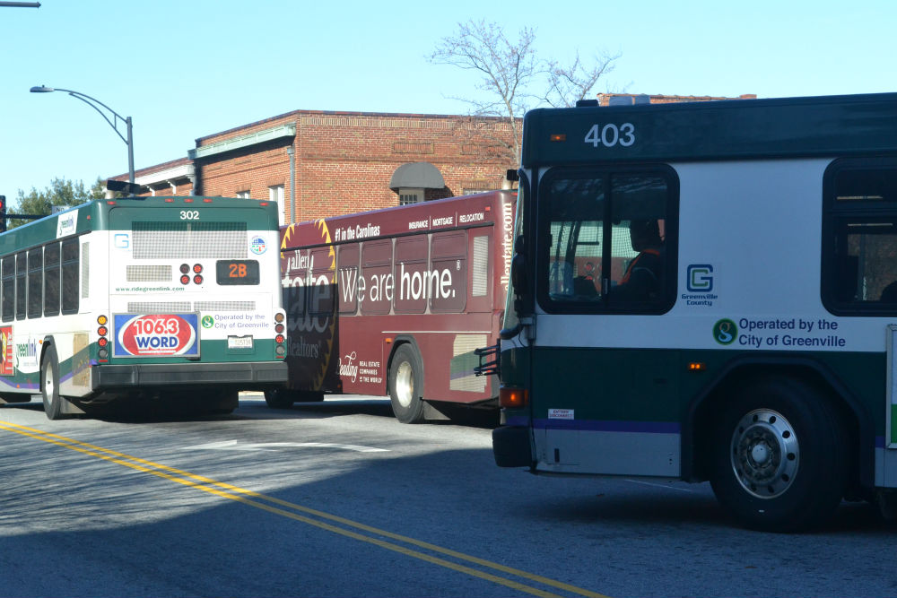 Greenlink buses pull out of the downtown terminal where they meet every hour during the weekday for passengers to transfer. (Photo/Ross Norton)