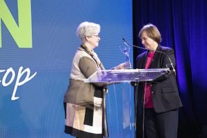 Carol Burdette awards Beth Padgett of Compass of Carolina with the Burdette Leadership Award. (Photo/Provided)