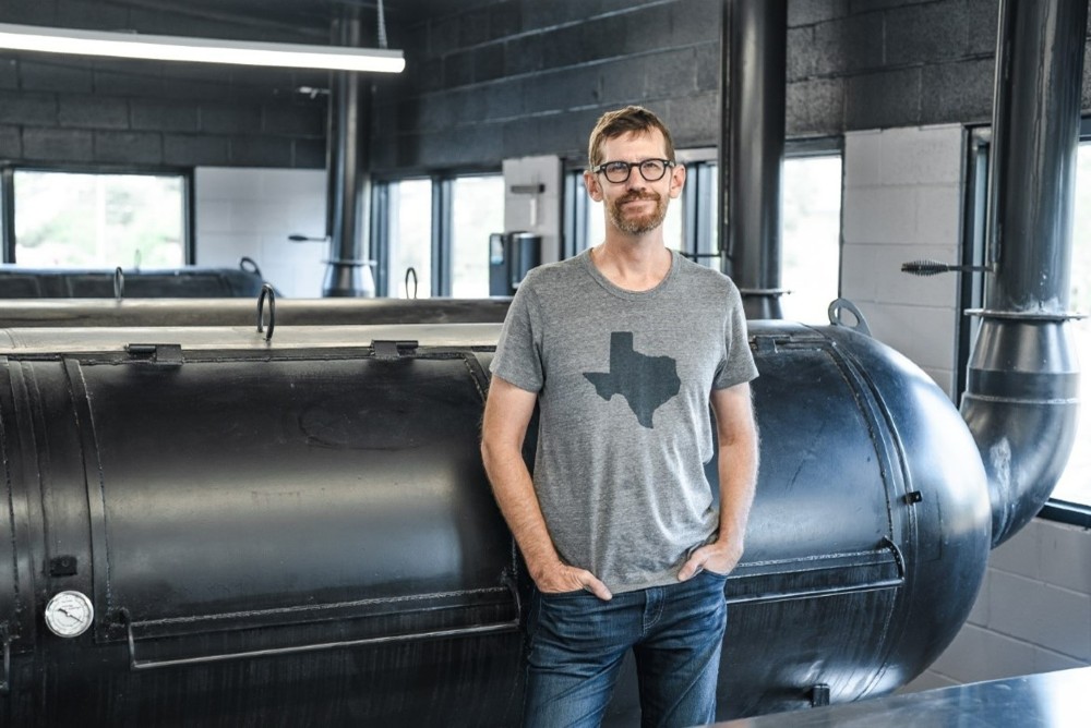 Lewis Barbecue Greenville owner and pitmaster John Lewis in the smokehouse area of the restaurant. (Photo/Savannah Bockus) 