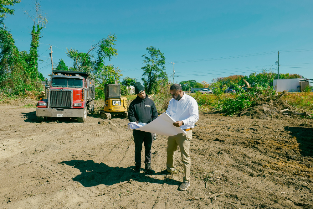 Justin Jenkins, right, CEO of Greenville-based Paveway Express, looks over project  plans. (Photo/Provided)