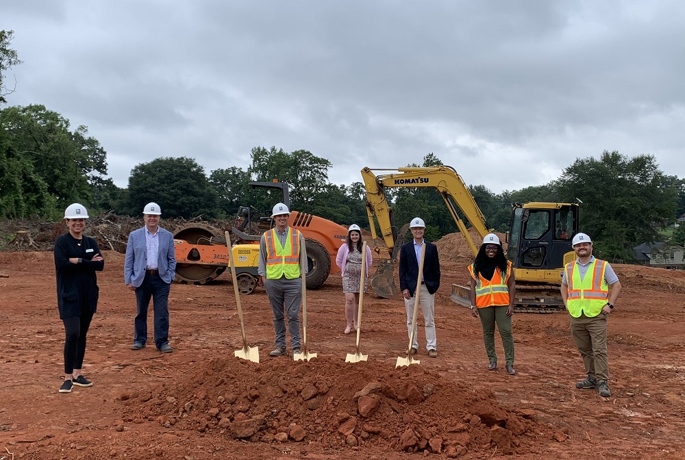 Representatives from CommunityWorks, the Greenville Housing Fund, Creative Builders, Iberia Bank and the city of Greenville broke ground on NHE's senior living community Renaissance Place last year. (Photo/Provided)