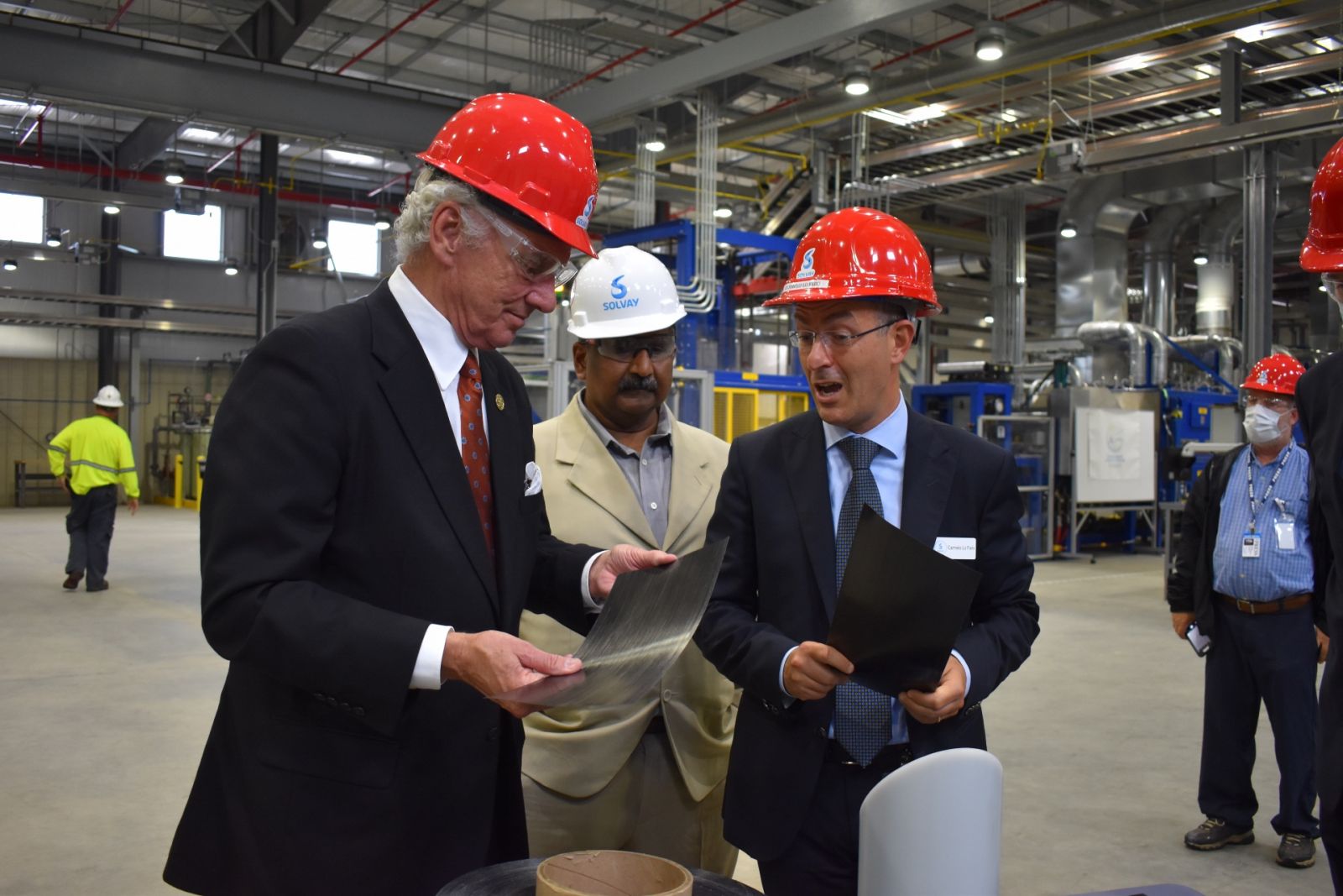 Solvay officials Prasad Donti and Carmelo Lo Faro discuss the new TPC product lines with Gov. Henry McMaster at the new Piedmont facility. (Photo/Molly Hulsey)