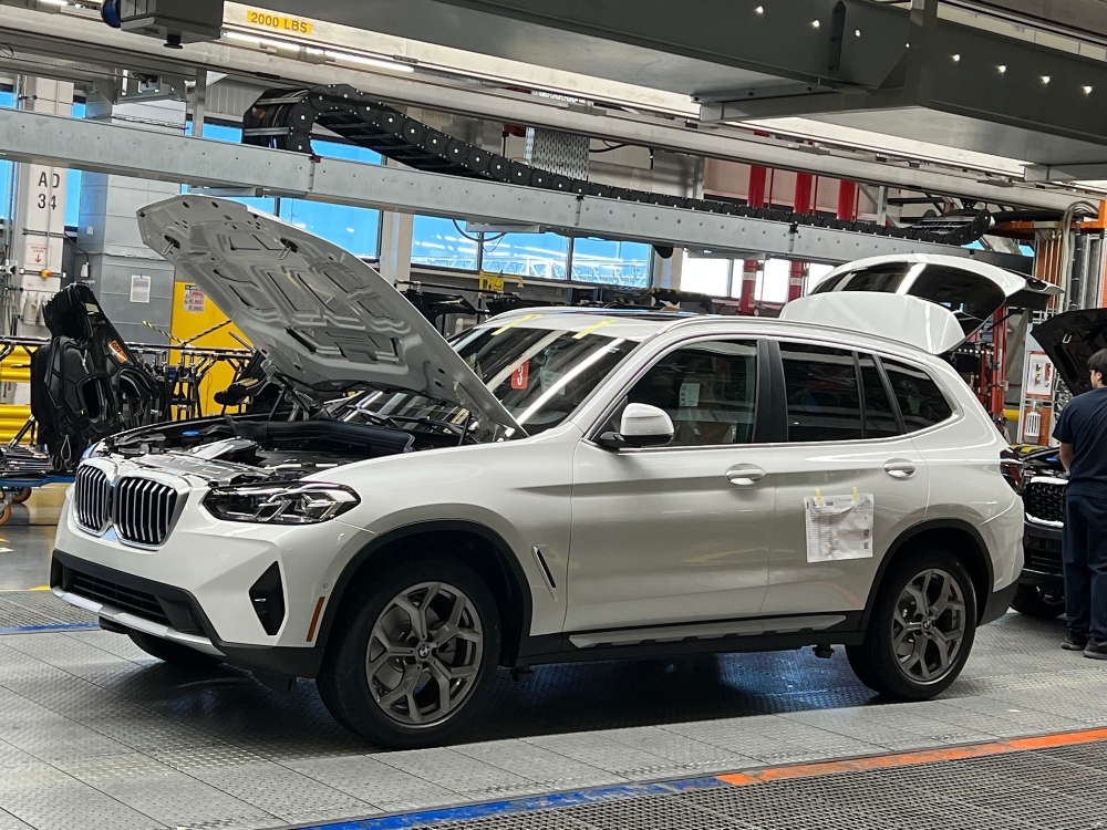 A new BMW moves along the assembly line at BMW Manufacturing during a plant tour in October 2022. (Photo/Ross Norton)