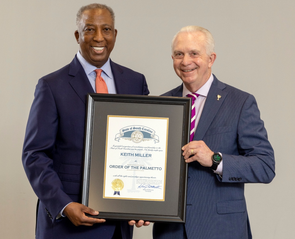 Greenville Technical College Area Commission Chair Ray Lattimore (left) presents the Order of the Palmetto to President Keith Miller. (Photo/Provided)