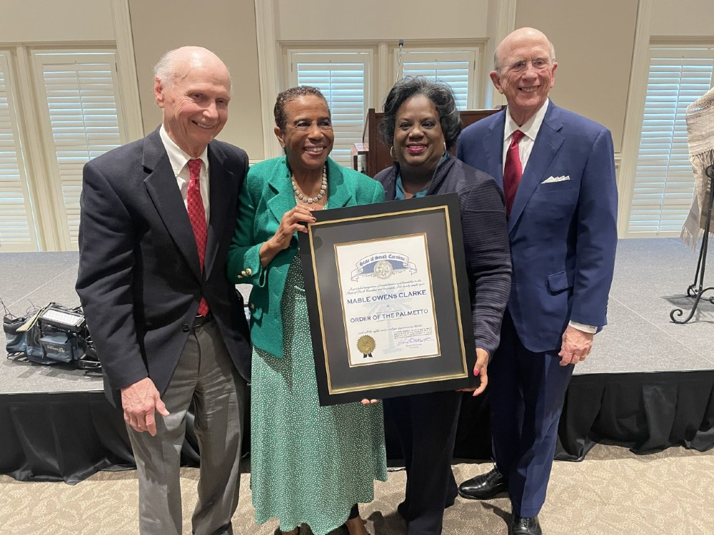 Former Secretary of Education Dick Riley, Mable Owens Clarke, Chandra Dillard and former Ambassador David Wilkins with the Order of the Palmetto. (Photo/Provided)