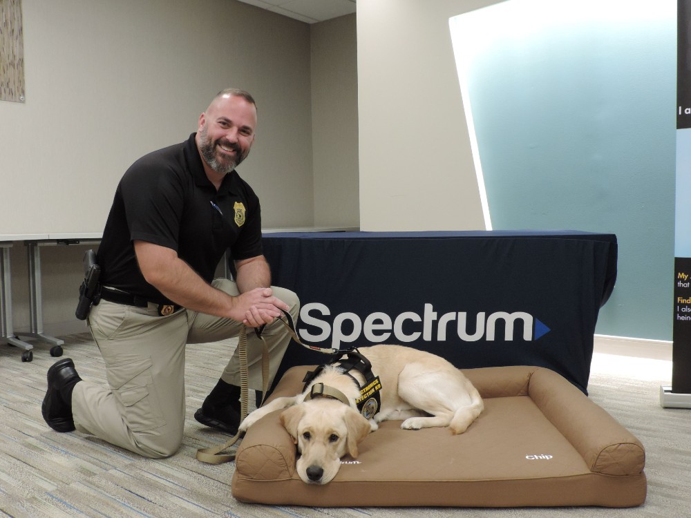 Benjy Partain, handler, and the K-9 Chip help sniff out evidence of crimes against children. (Photo/Provided)
