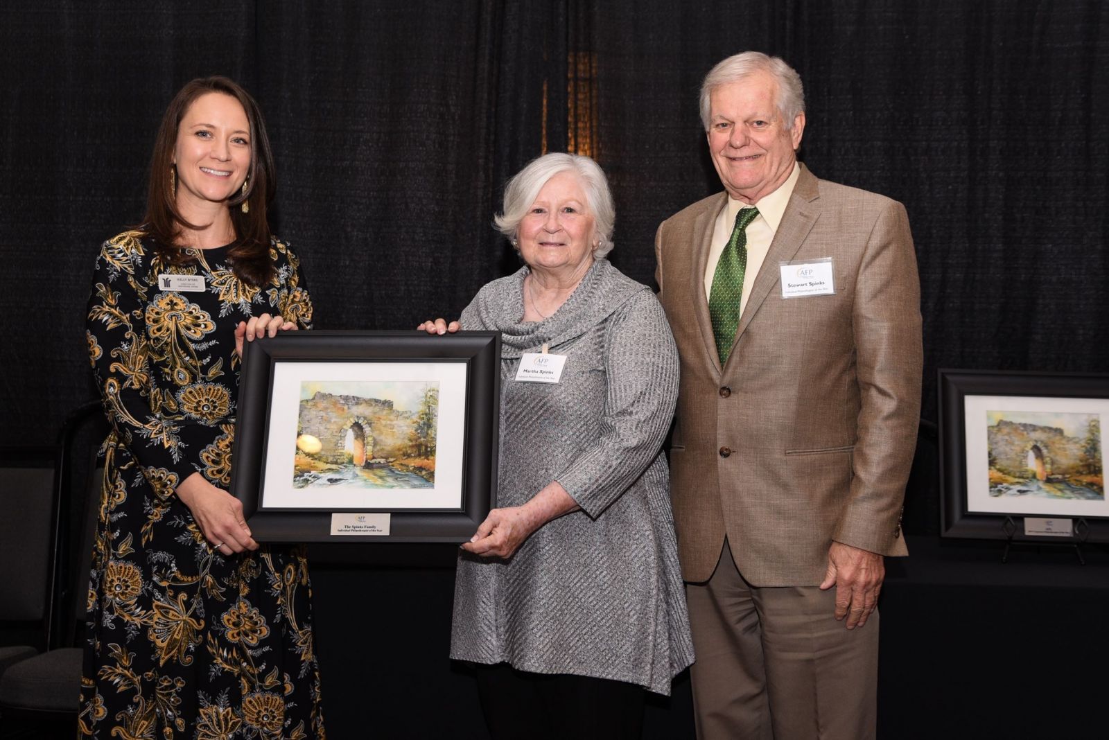 Martha and Stewart Spinks receive a rendering of the Poinsett Bridge in appreciation of their philanthropy.
