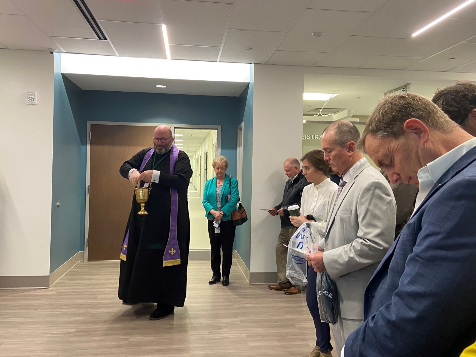 A priest blesses the new facility during the March 31 groundbreaking. (Photo/Provided)