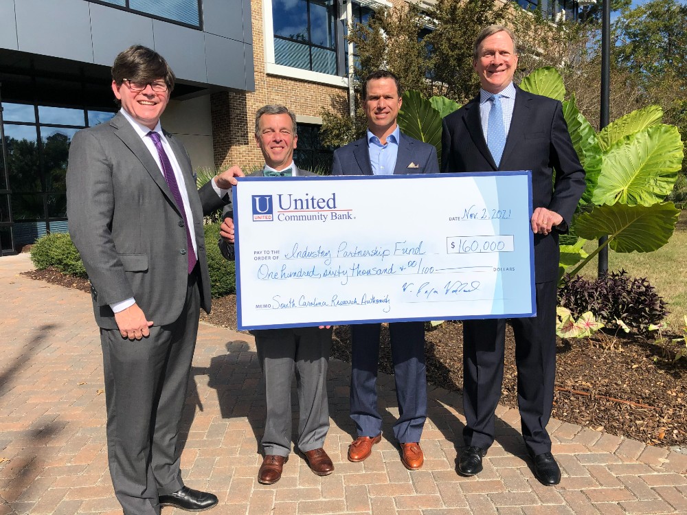 Allen Gillespie and Chip Hardy of FinTrust, Dixon Woodward of United Community Bank and Bob Quinn of SCRA take part in a presentation to recognize the gift. (Photo/Provided)