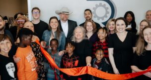 Staff members and their families celebrate the opening of the first official office for R&R Resolute Staffing Firm on Old Buncombe Road in Greenville. (Photo/R&R Resolute Staffing Firm)